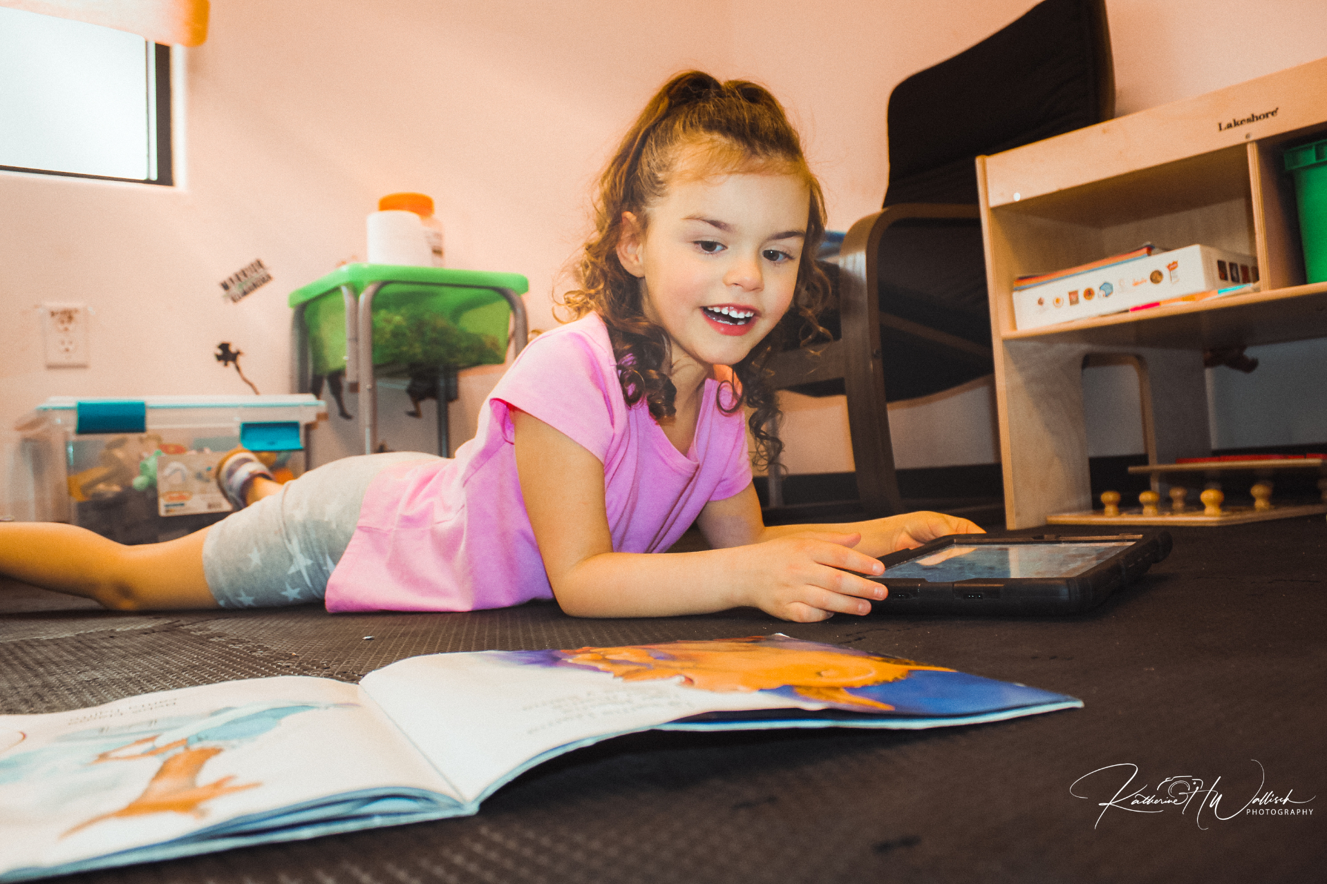 A child using a speech-generating AAC device with a therapist modeling vocabulary