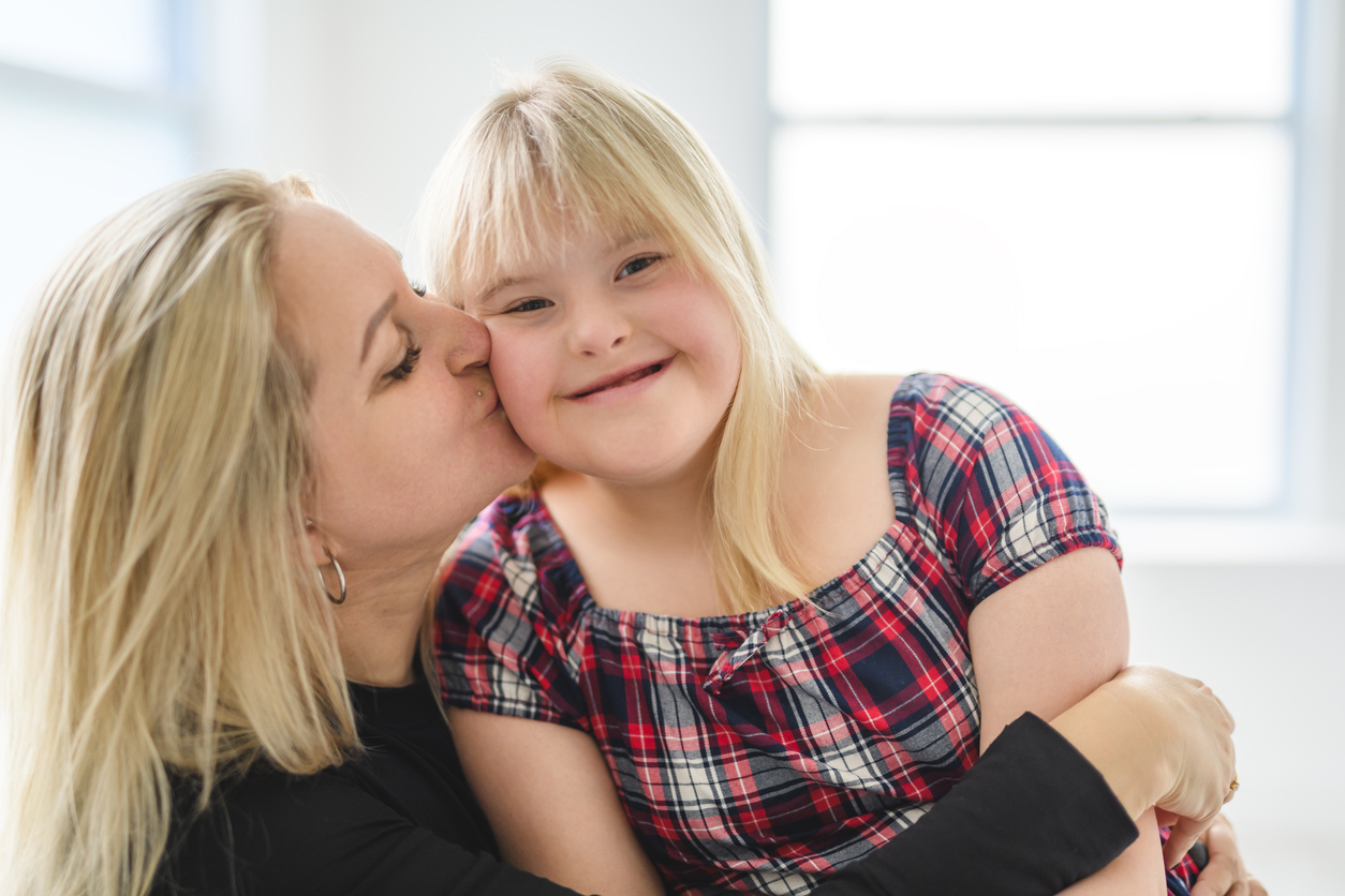 A caregiver reviewing therapy and insurance information with a clinician